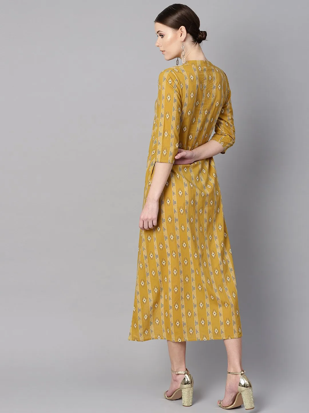 Mustard yellow color ikat printed chinese collar dress with placket opening.